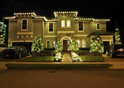 front walkway of house with christmas lights